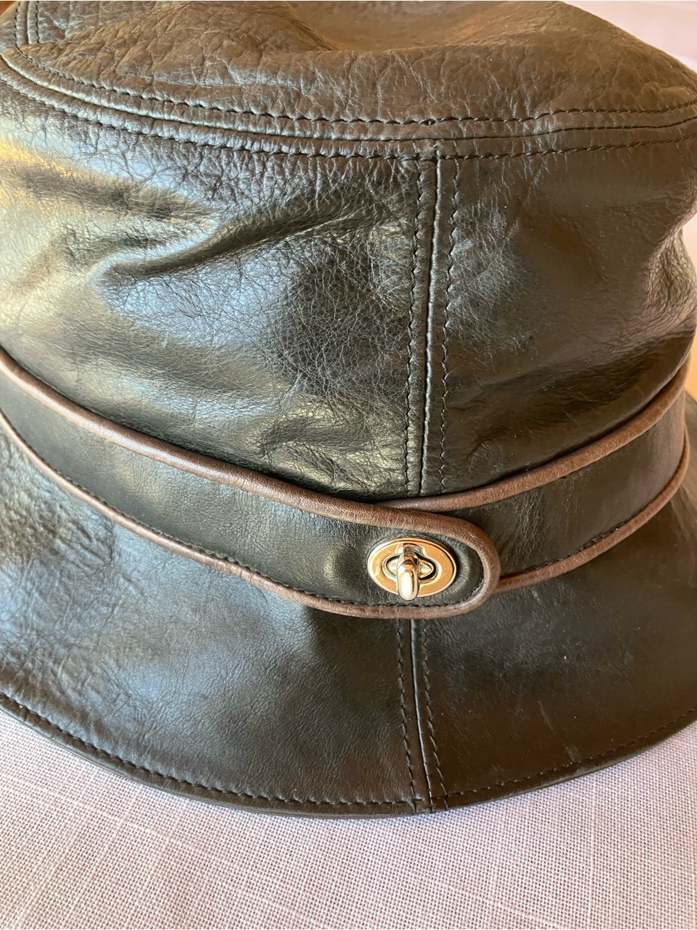 Coach Brown Leather Bucket Hat with Gold-Tone Turnlock